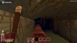 A red pipe runs below a low stone ceiling in the sewer passage